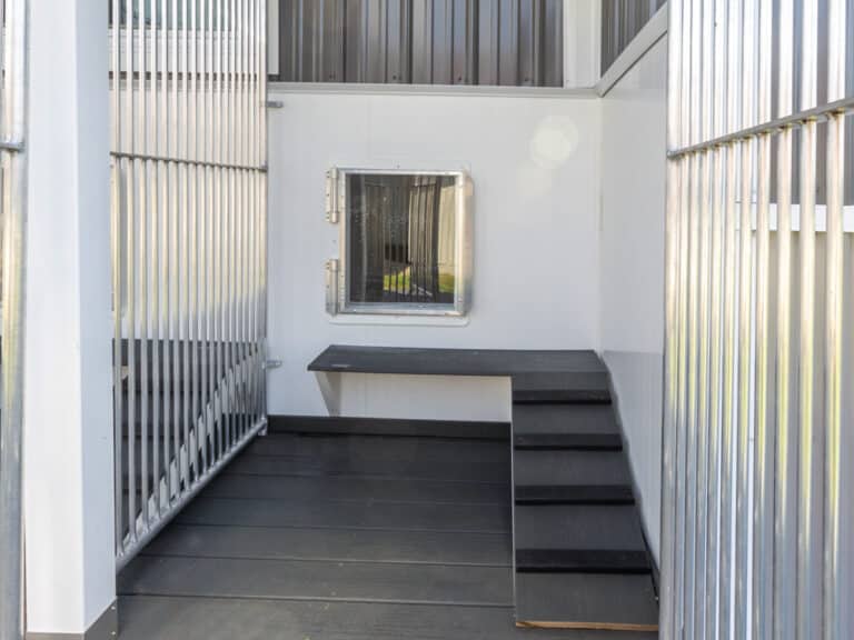 gray decking inside kennel